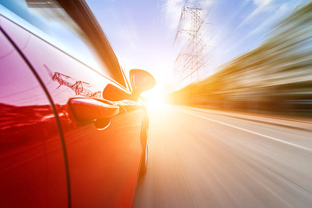 istock car driving on a motorway at high speeds 476976991