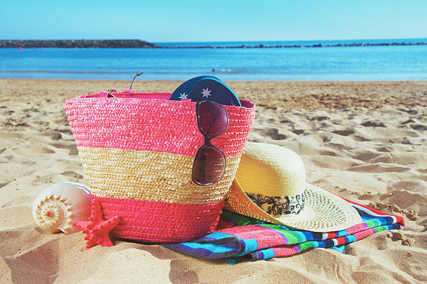istock strwa bag with sunbathing accessories on sandy beach 476977806