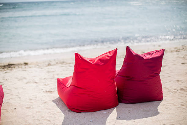 red bean bags ready to be seated on