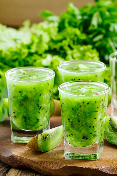 istock Green healthy drink fresh fruit and vegetables, selective focus 476983310