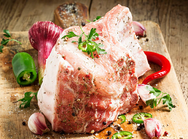 istock Fresh whole pork loin with spices, selective focus 476983396