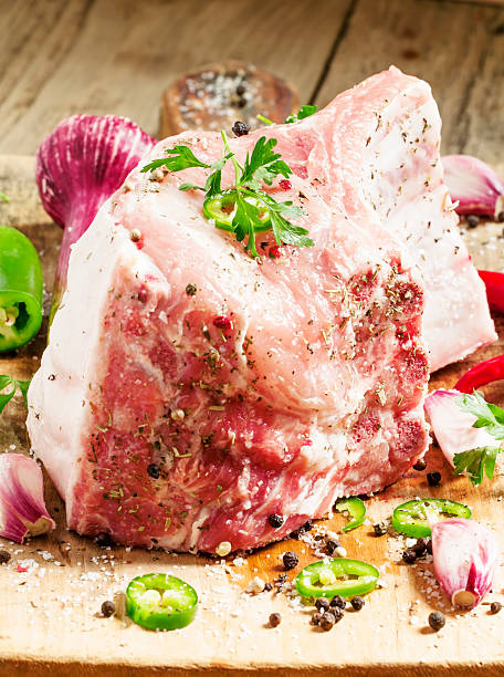istock Fresh whole pork loin with spices, selective focus 476983410