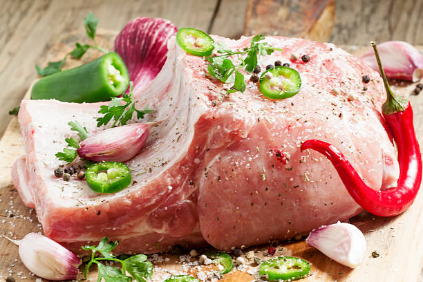 istock Fresh whole pork loin with spices, selective focus 476983434