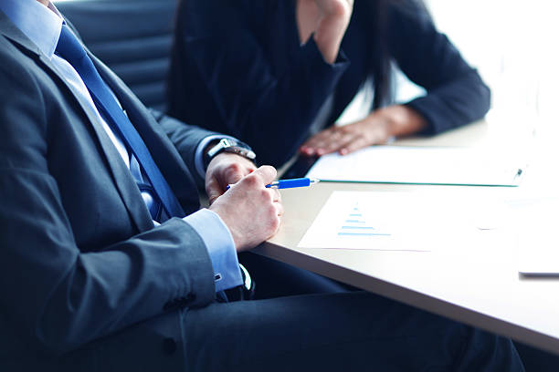istock businessman at desk 476984136