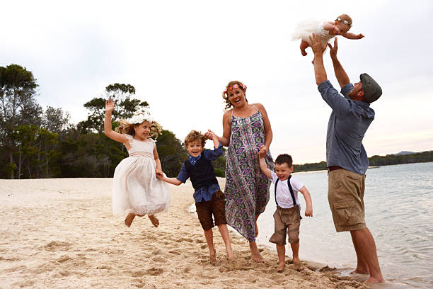 istock Happy Family Playing at the beach 476986538