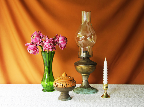 still life with lamp,vase,lotus,brass tray with pedestal,earthen bowl.