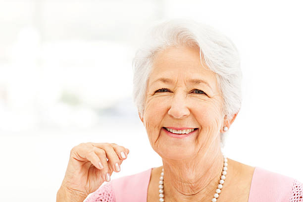 istock Senior Woman Smiling In House 476988932