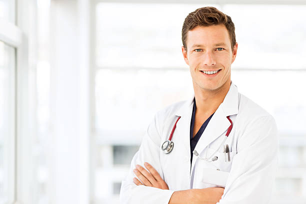istock Smiling Young Doctor In Hospital 476989192