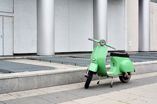 Berlin, Germany - May 18, 2015: a parked scooter on the roadside in the city center of Berlin