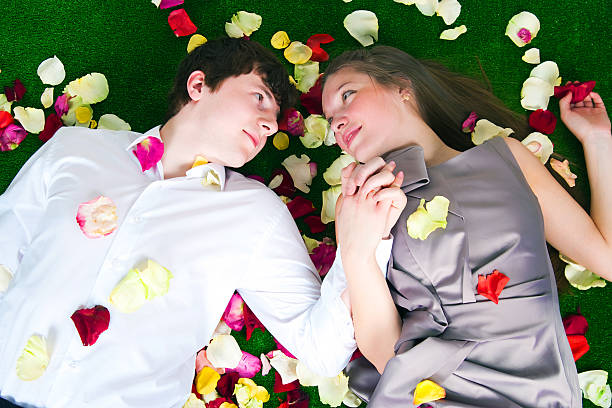 beliebte - human hair women horizontal rose petals stock-fotos und bilder