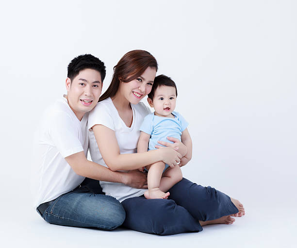 istock Thai family smiling with happily isolated 476994226