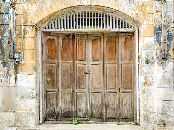 Old wooden door in ancient building stock photo