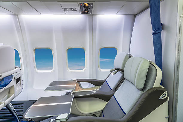 istock Airplane cabin business class interior view 476995750
