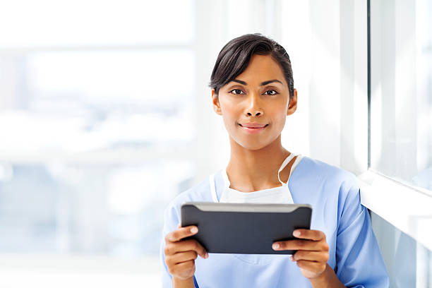 istock Confident Surgeon Holding Digital Tablet In Hospital 477000054