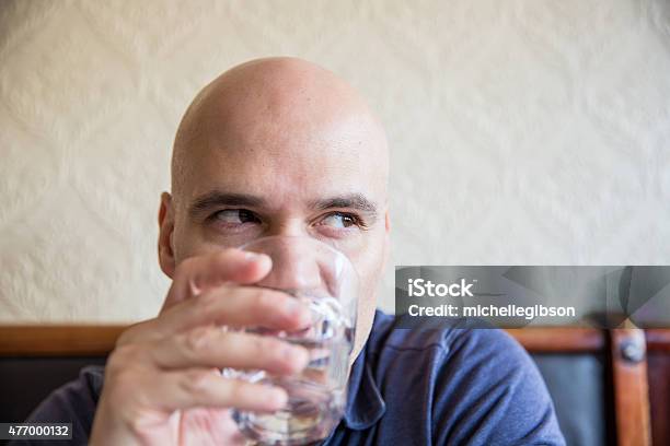 Man Drinking A Glass Of Water Stock Photo - Download Image Now - 20-29 Years, 2015, 30-39 Years