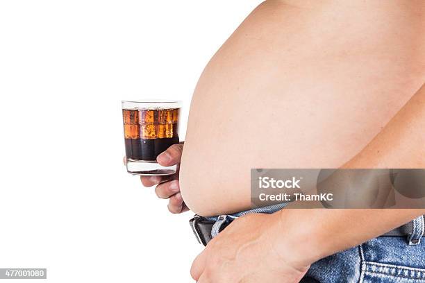 Man With Big Belly Holding A Glass Of Fizzy Soda Stock Photo - Download Image Now - 2015, Adult, Adults Only