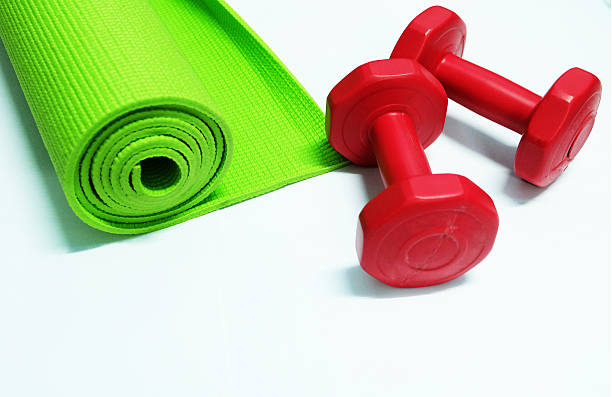 istock yoga mat and dumbell 477001360