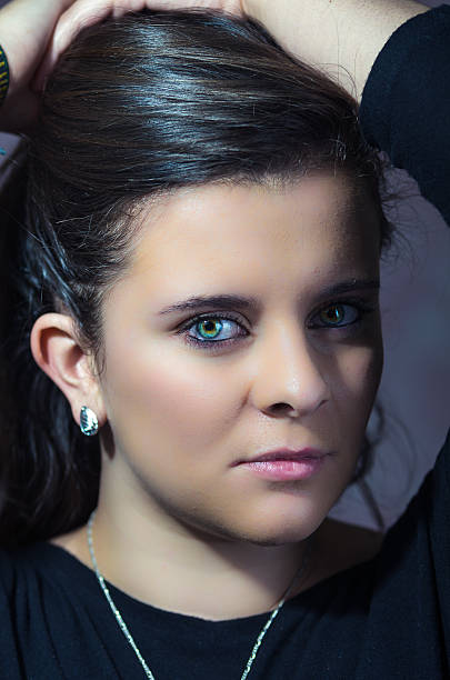 istock pretty brunette with intense eyes closeup 477004218