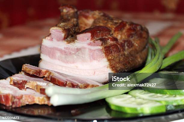 Pieces Of Fresh Cooked Meat With Spring Onions Stock Photo - Download Image Now - 2015, Cooking, Crockery