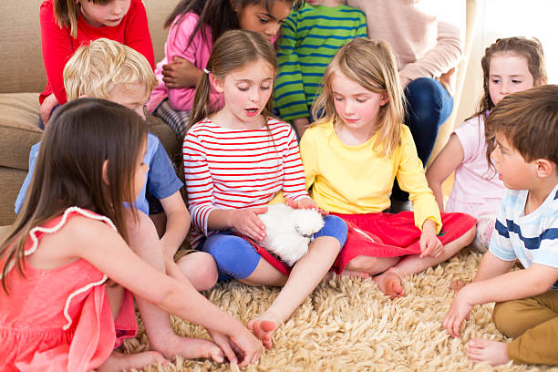 istock Children With A Pet Chicken 477005858
