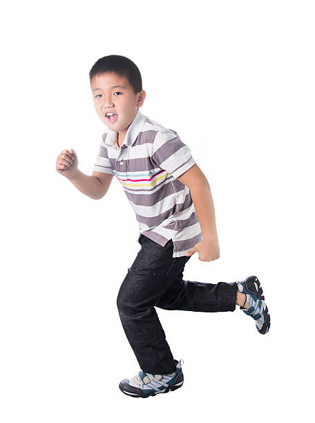 istock Asian boy running, isolated on white background 477006544