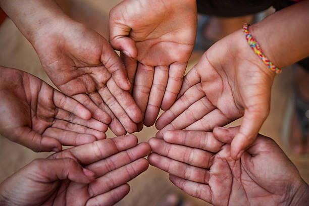 istock Family holding hands together closeup 477006945