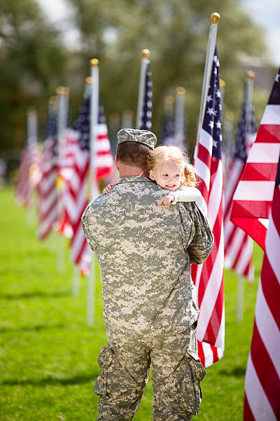 istock American soldier hugging his toddler daughter 477009768