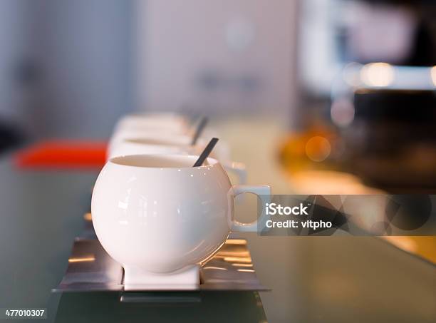 White Porcelain Contemporary Cups With Stainless Steel Saucers And Spoons Stock Photo - Download Image Now