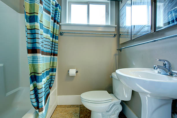 istock Cozy bathroom with striped curtains 477010871