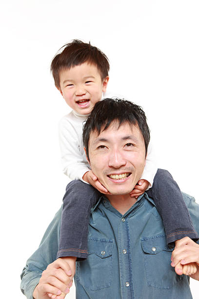 istock Japanese father giving his son piggy back 477010879