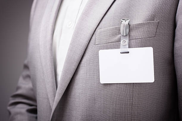 istock Businessman wearing blank name tag 477010912