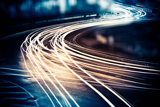 light trails the light trails on the modern building background in shanghai china. long exposure stock pictures, royalty-free photos & images