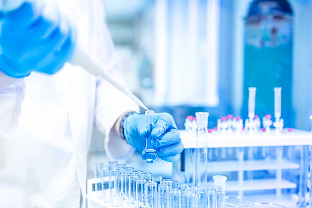 istock Medical Scientist and chemist in laboratory using  an pipette 477013810