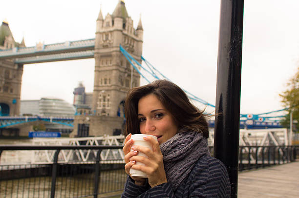 istock Beautiful woman warms up drinking from a coffee cup 477015325