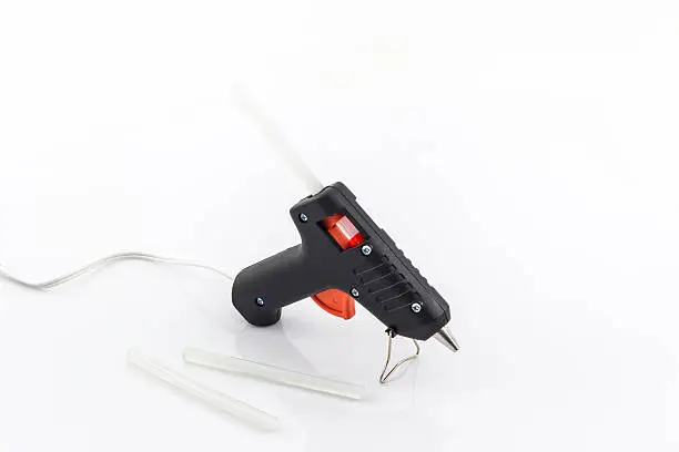 Electric hot glue gun on a white background.