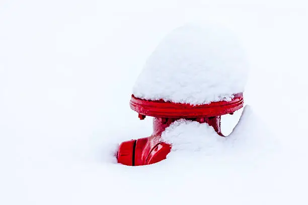 Red Fire Hydrant covered with snow
