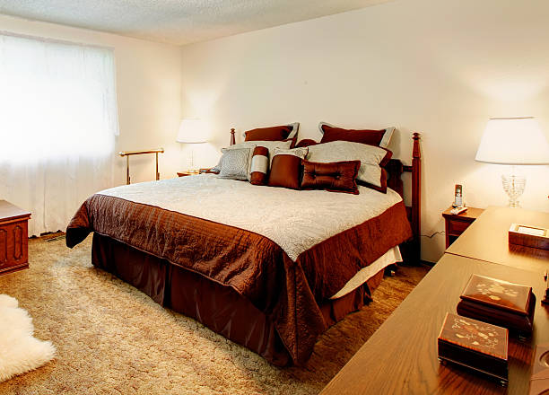 istock White cozy bedroom with tv 477016315
