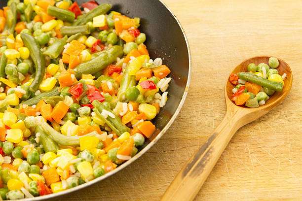 istock vegetable mix in the pan on wooden background 477016986