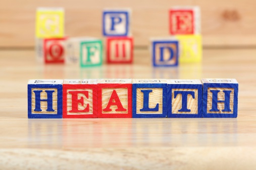 Wooden blocks with letters. Educational toy concept - children health care.