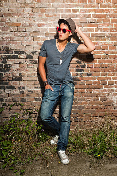 istock Urban asian man with red sunglasses. Good looking. Cool guy. 477021513
