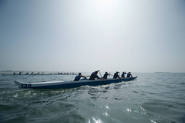 Outrigger Canoeing Team In Race stock photo