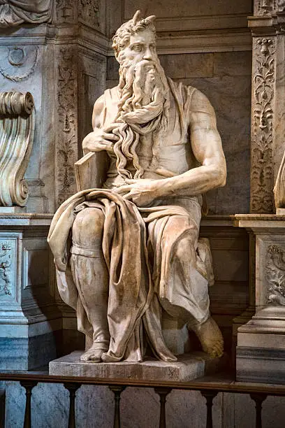 Michelangelo's statue of Moses. Commissioned in 1505 by Pope Julius II for his tomb, it depicts the Biblical figure Moses with horns on his head, based on a description in the Vulgate, the Latin translation of the Bible used at that time.