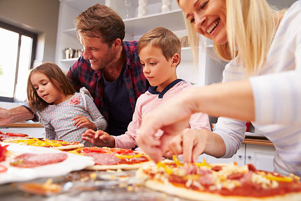 istock Family making pizza together 477022640