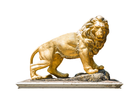 Golden lion statue isolate on white background with clipping path