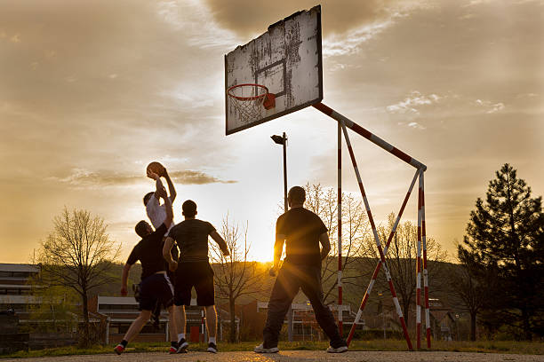 istock Street basketball at sunset 477027574