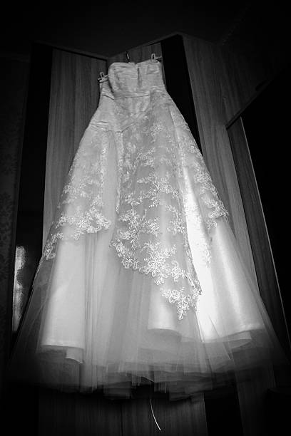 istock Wedding dress hanging 477028190