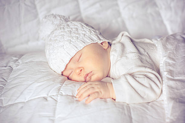 istock little baby sleeping sweetly 477028632