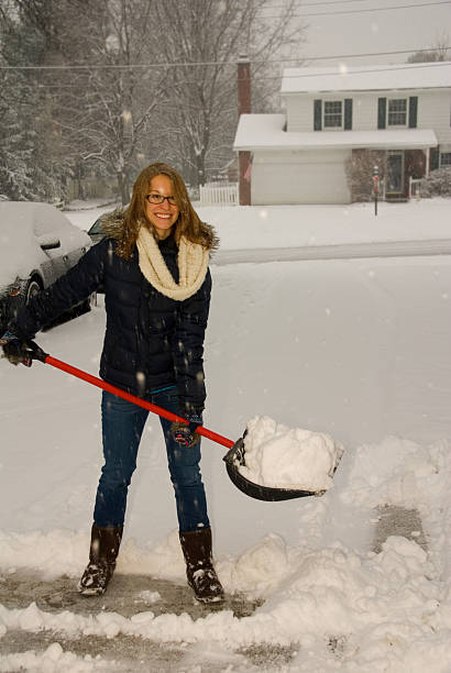istock Shoveling Snow Portrait Smiling 477033228