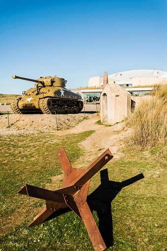 Normandy, France - April 5, 2015: US tank standing in front of a museum. It was placed to remembering the Operation Overlord in Normandy