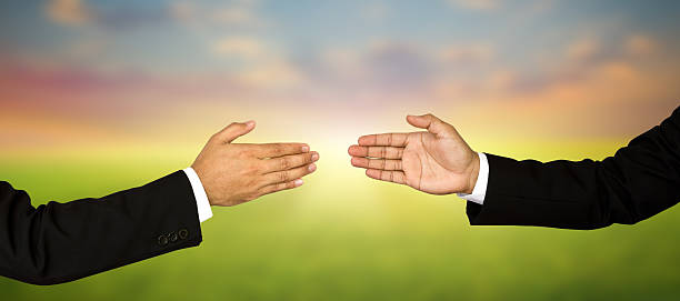 istock Two business male hands about to shake 477036777